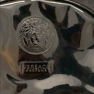Women’s small black Versace perfum backpack